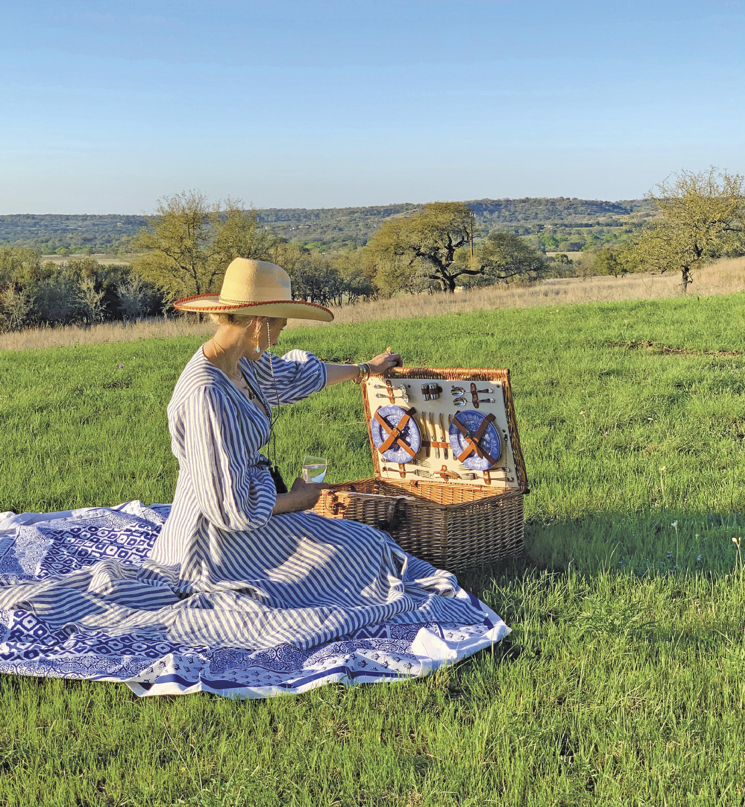 Spring picnics on the front lawn were magical. Lewis wears a Behida Dolíc dress and a hat gifted to her by her father.