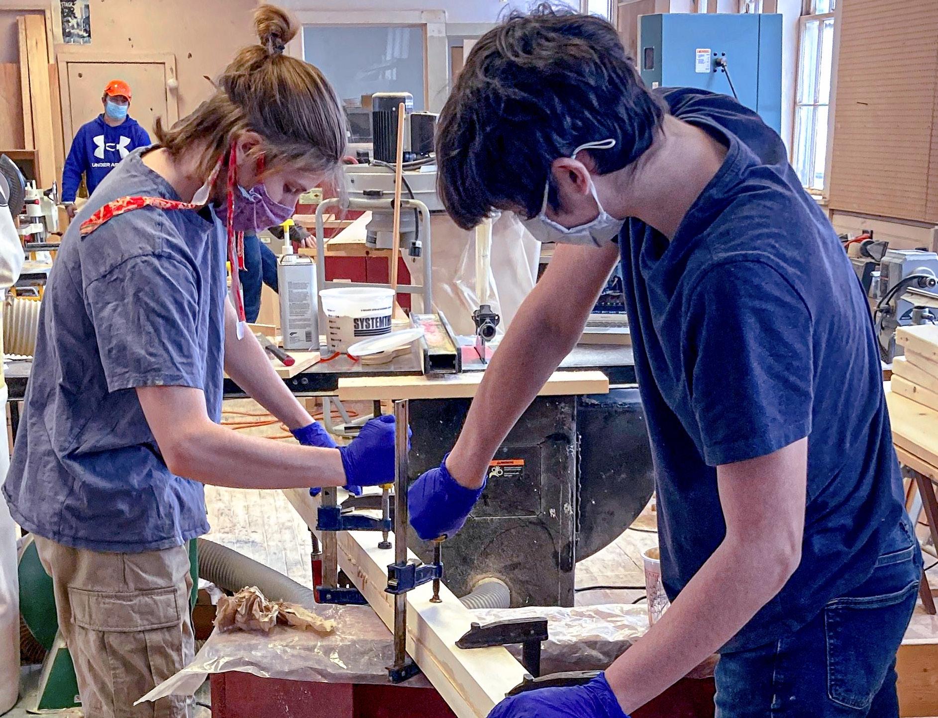 Oliver Lardner ‘23, left, and Austin Chandler ‘23 construct blanks to use in making sweeps in last year’s Boatbuilding class.