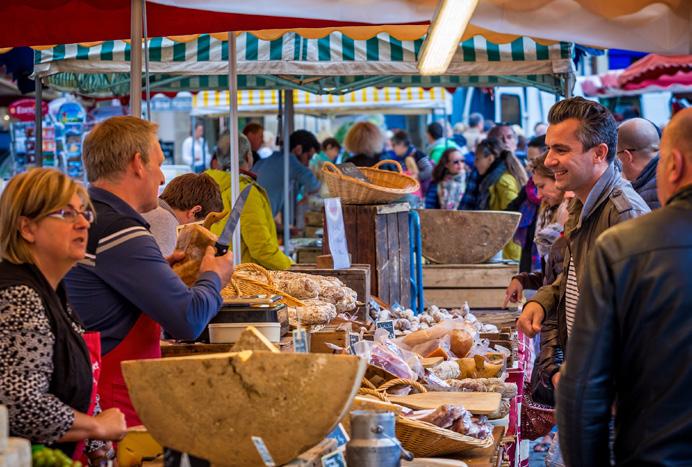 A lively and inviting market scene. In a true Organic Christian society, the economy goes beyond the mere material sustenance of man, seeking also to to reflect and develop his social, cultural and spiritual sides.