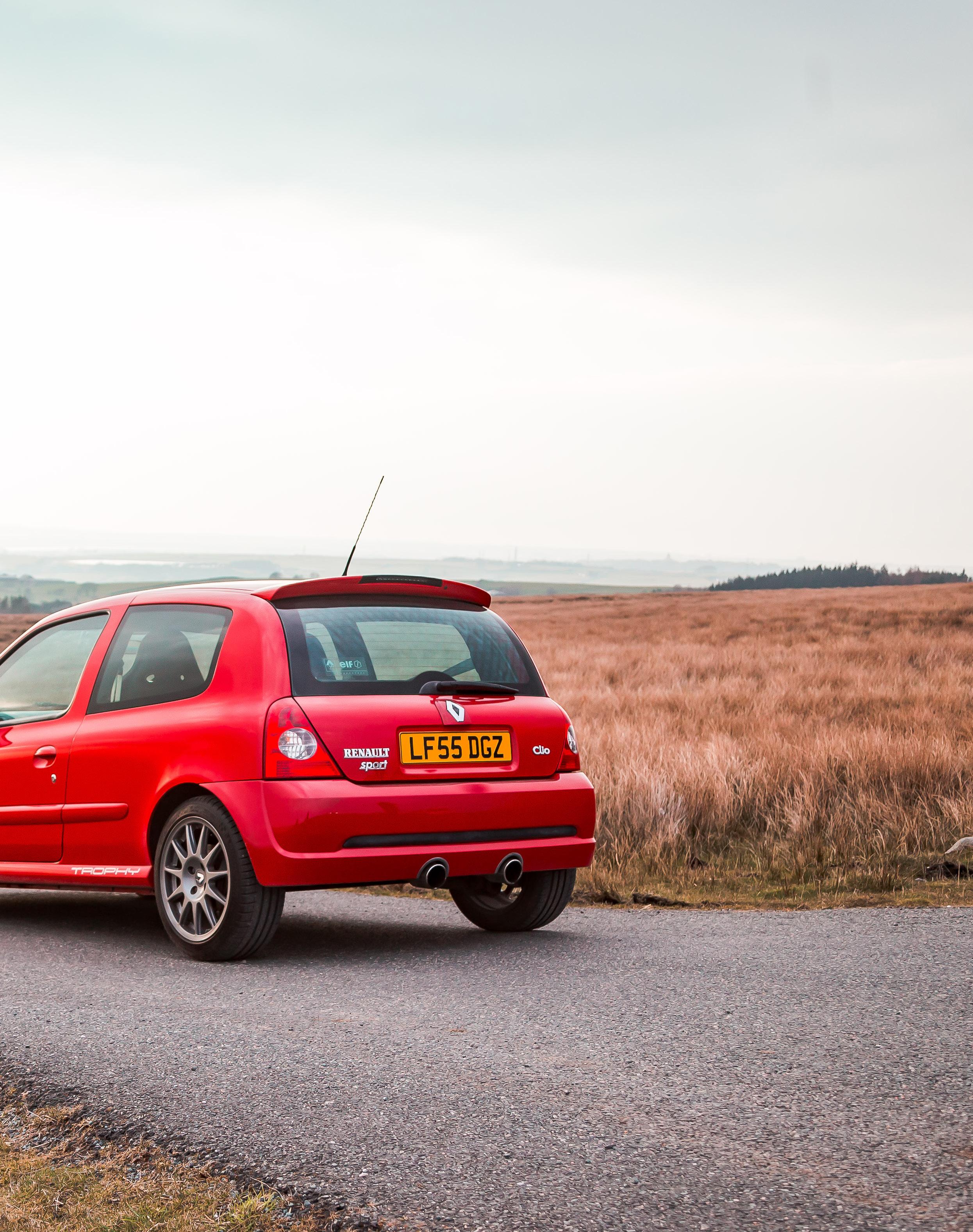 Blue Silver Renault Clio 2 0 16V Viewed Against Dramatic Sky Stock