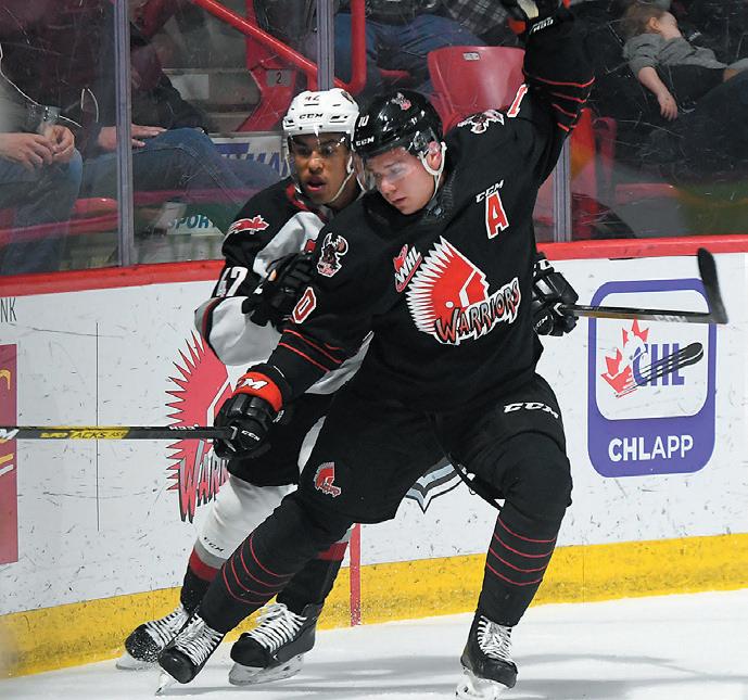 Saskatoon, Canada. 31st Mar, 2023. Regina Pats forward Connor Bedard (98)  faces off against Saskatoon Blades forward Lukas Hansen (28) during the  first period of WHL playoff hockey action in Saskatoon, Sask.