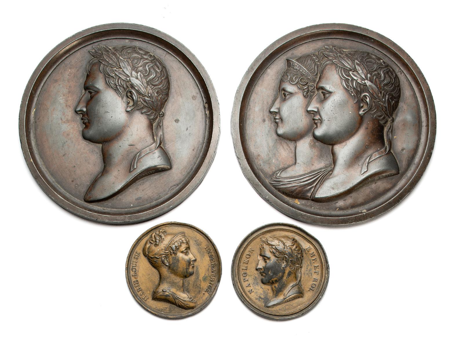 Bonhams : Framed Napoleon Medallions, a set of four frames containing  medallions relating to Emperor Napoleon. The first frame with single brass  medallion, the second containing eight white metal medallions depicting  varying