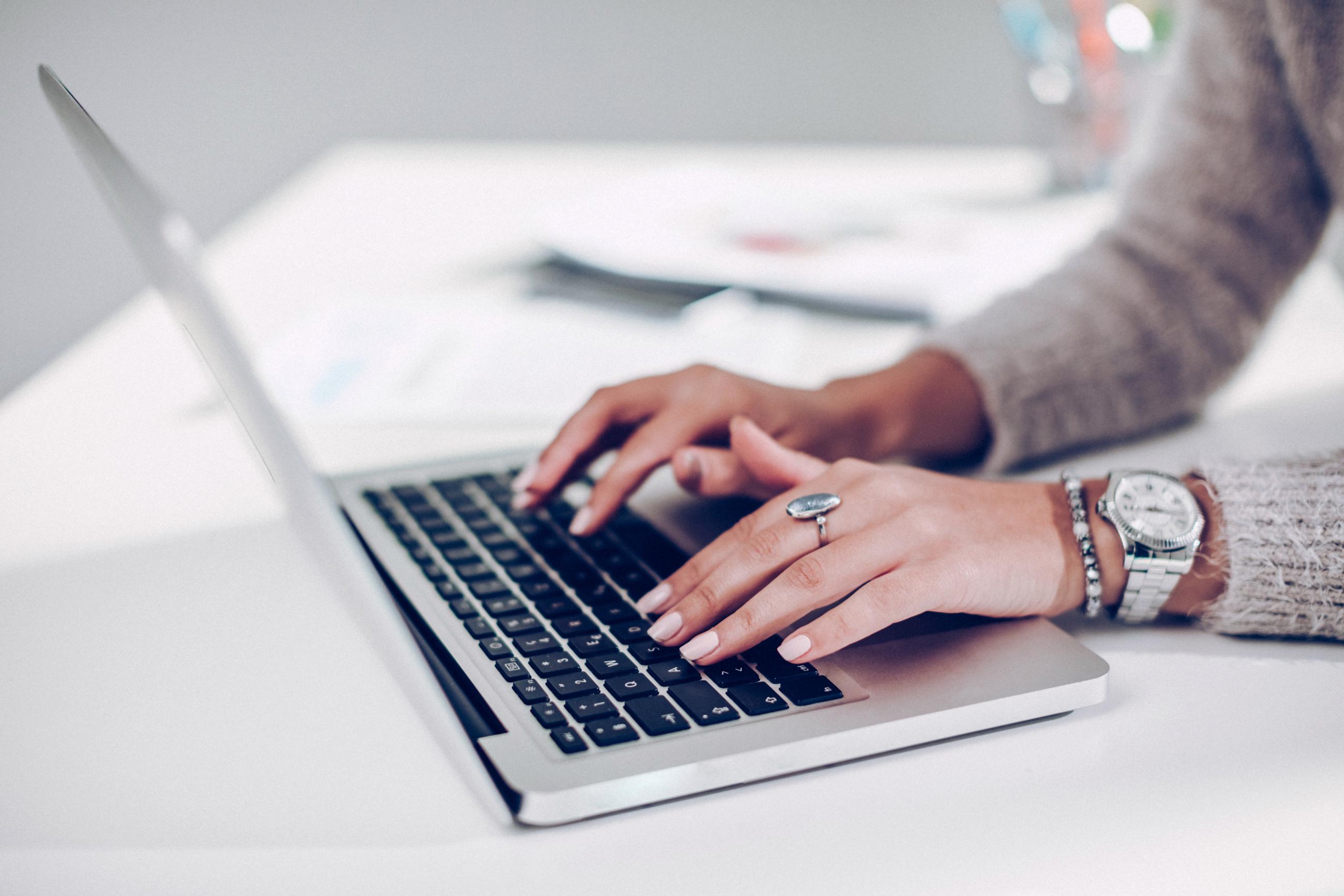 Hand typing on laptop narrow picture. Online from filling data entry. Online notebook. Data entry services. Copy typing.