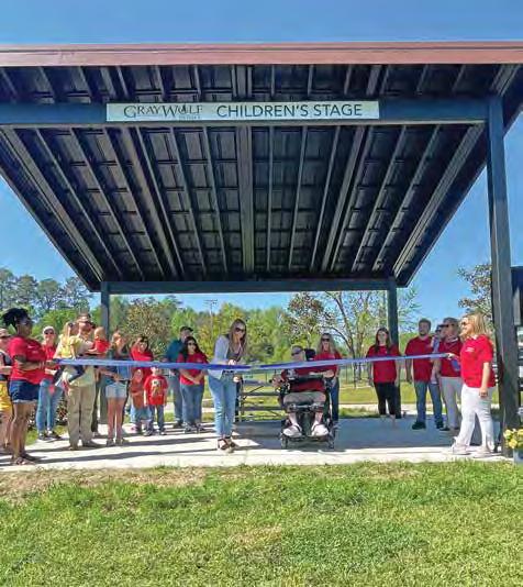 Ribbon cutting for children's stage held at Partnership for Children Park