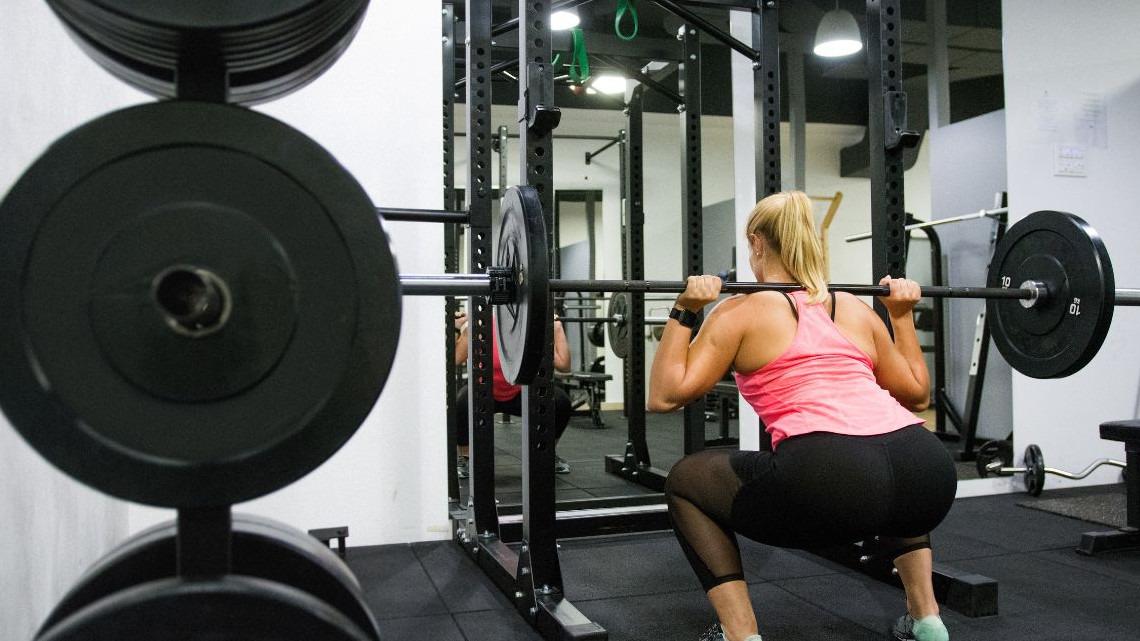 This Expert Guide Shows Beginners How To Use A Squat Rack Correctly For