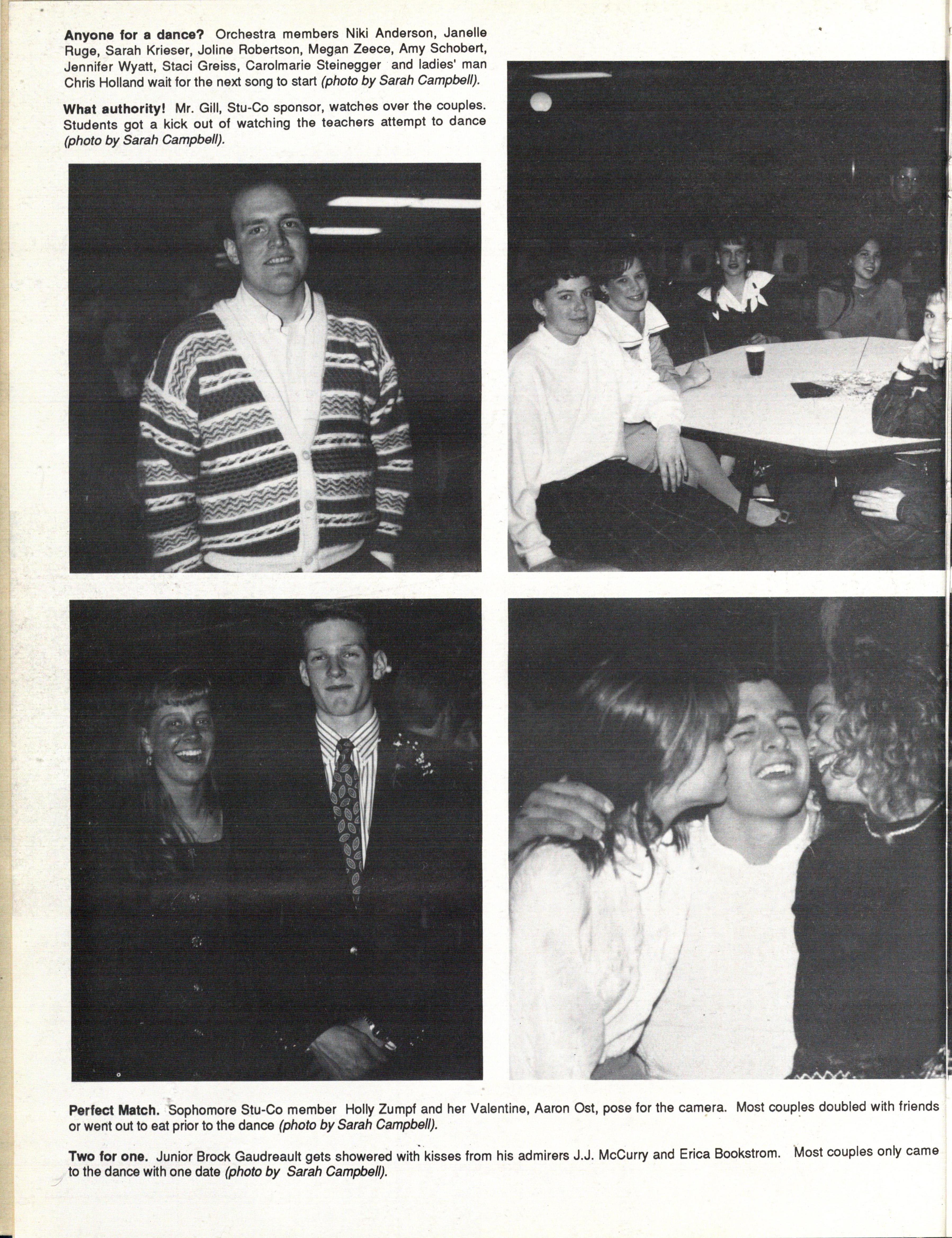 Stol ostidagi paypoqdagi bekasining mushukini yalash