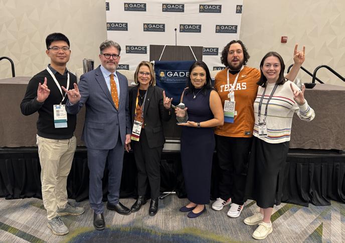 Faculty and doctoral students celebrate Cubbin's award during the Council on Social Work Education annual program meeting.