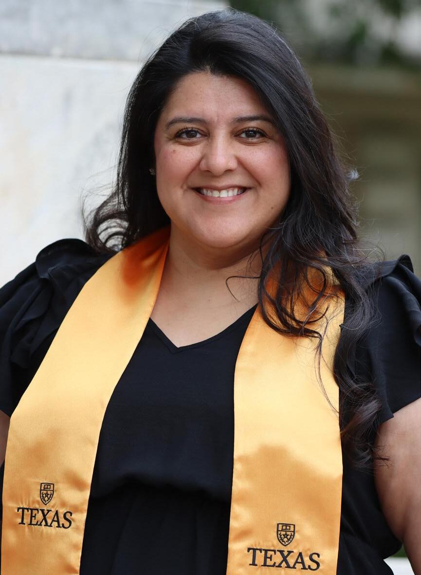 Lori Medeiros poses for graduation photos ahead of her May 2025 BSW graduation ceremony.